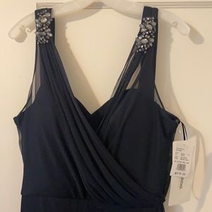 New with tag, navy long formal dress. David’s Bridal